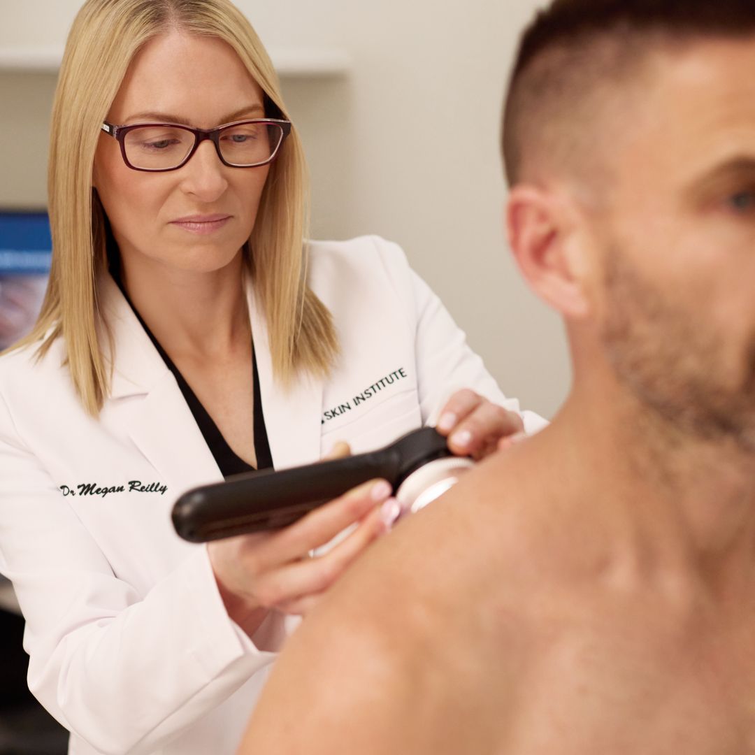 Dr Megan Reilly performing a skin cancer spot check